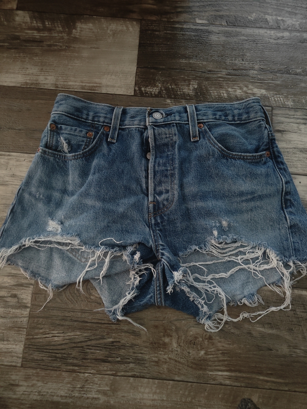 Levi's Raw Hem Distressed Denim Shorts in Blue